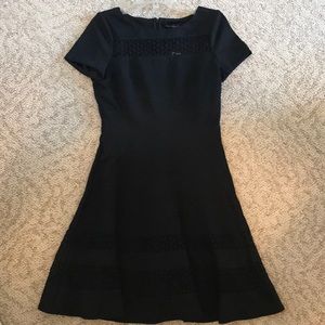 Black, fit and flare zip-up dress.